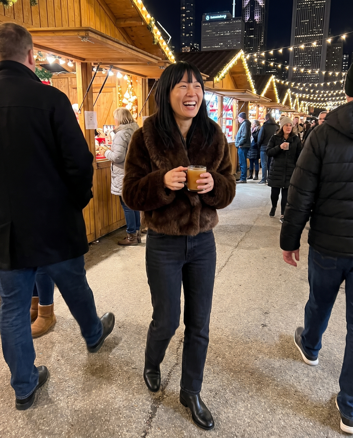 Cropped Faux Fur Coat with Shawl Collar — at a holiday market at night