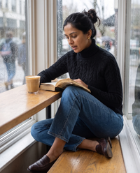 Gloucester Warm Cable Knit Ribbed Turtleneck Sweater — reading in a café on a rainy afternoon