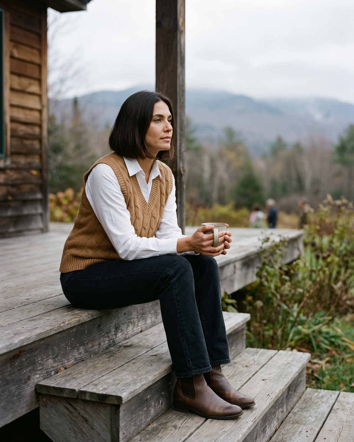 Falmouth Versatile Cable Knit Sweater Vest — with tea on a Vermont cabin porch