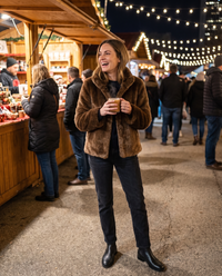 Short Faux Fur Coat with Stand Collar — at a holiday market at night