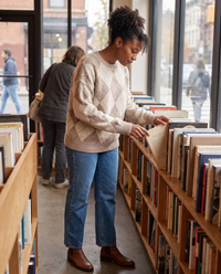 Lantern Oversized Argyle Drop-Shoulder Crew Neck Sweater — browsing a Brooklyn bookstore