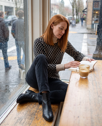 Sunstone Chic Patterned Stand-Collar Sweater — reading in a café on a rainy afternoon