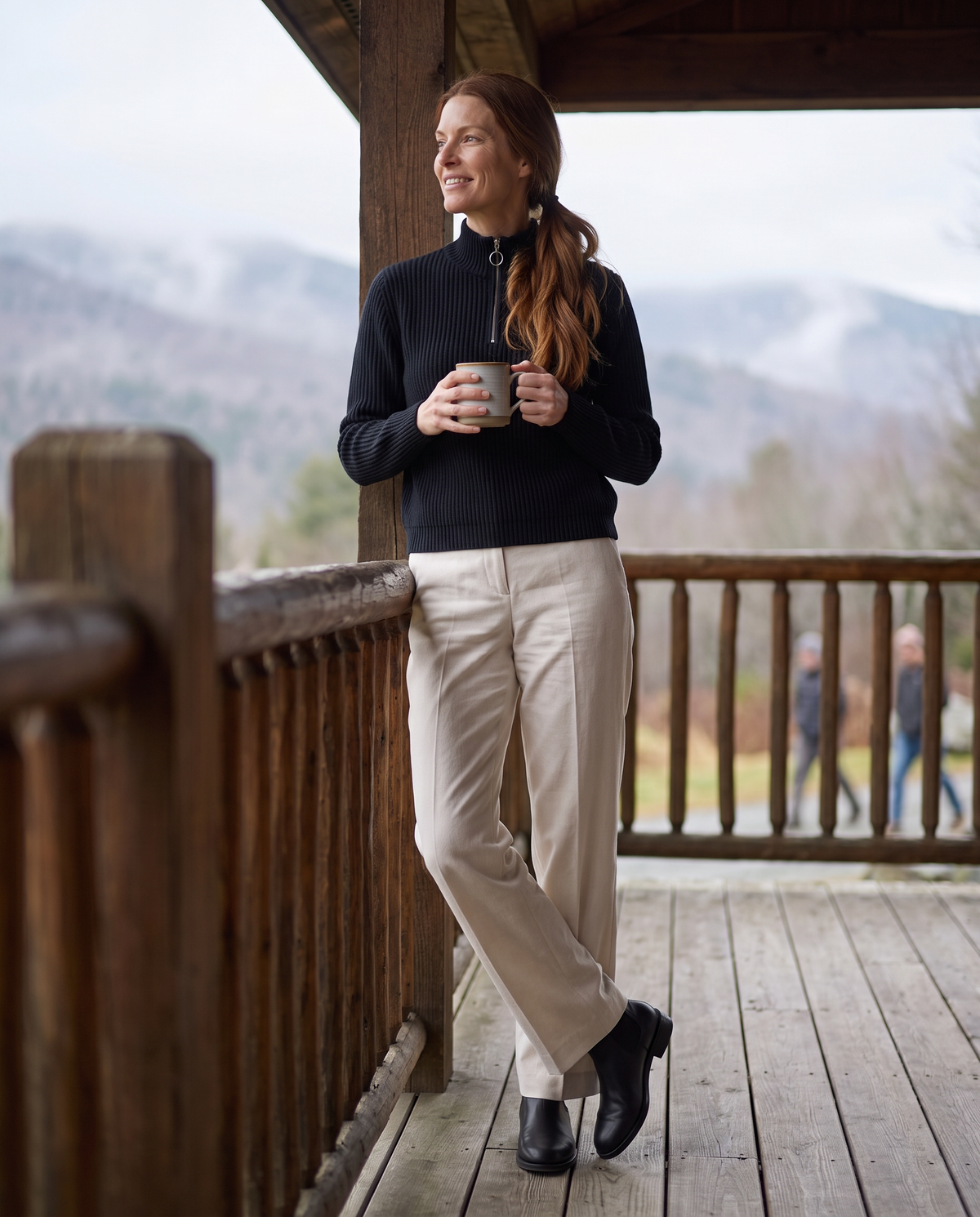 Kestrel Sleek Ribbed Half-Zip Mock Neck Sweater — with tea on a Vermont cabin porch