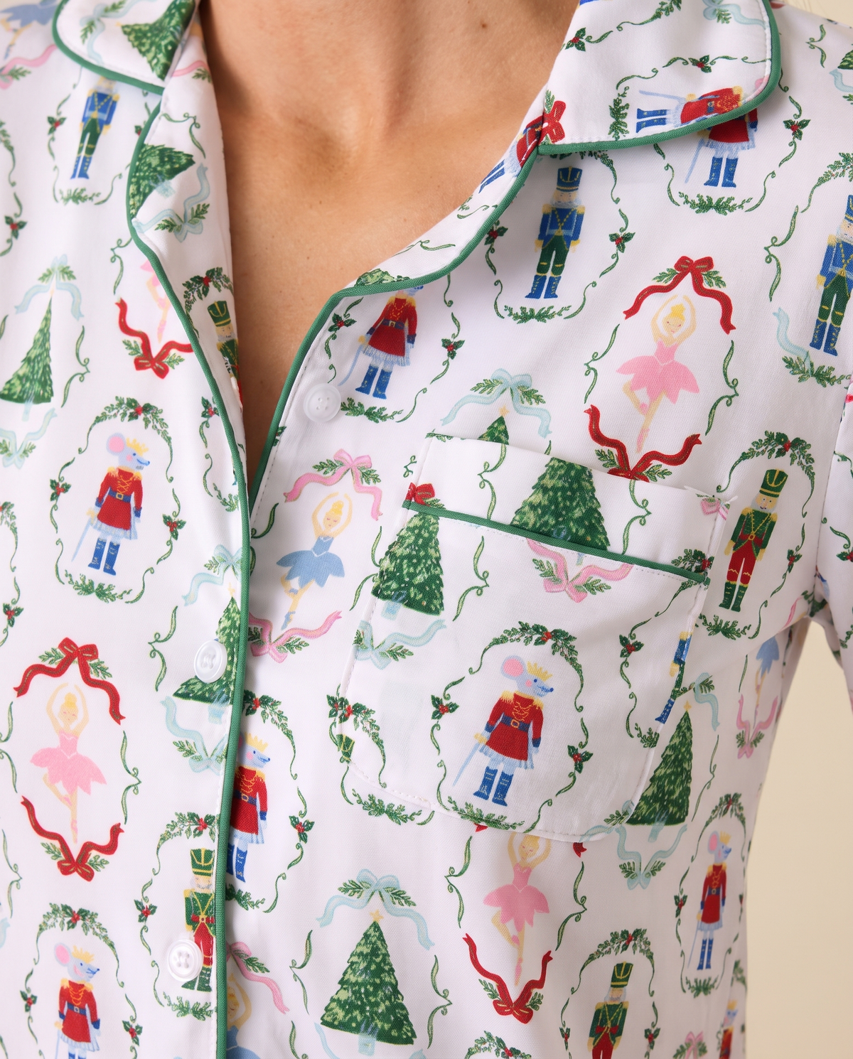 Women's Christmas Pajama Top, Nutcracker Print — close-up of print, green piping, pocket and buttons