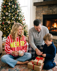 Women's Christmas Sweater, Striped Merry Sweatshirt — worn with hot cocoa opening presents on Christmas morning