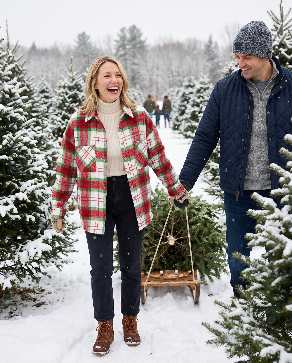 Christmas Plaid Flannel Shacket with Pockets — red, cutting a Christmas tree at a snowy Vermont tree farm