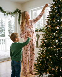 Women's Christmas Pajamas, Pink Satin Bunny Print PJ Set — decorating the Christmas tree on a snowy morning