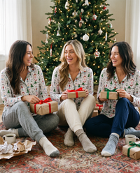 Women's Christmas Pajama Top, Nutcracker Print — friends opening presents by the tree on Christmas morning
