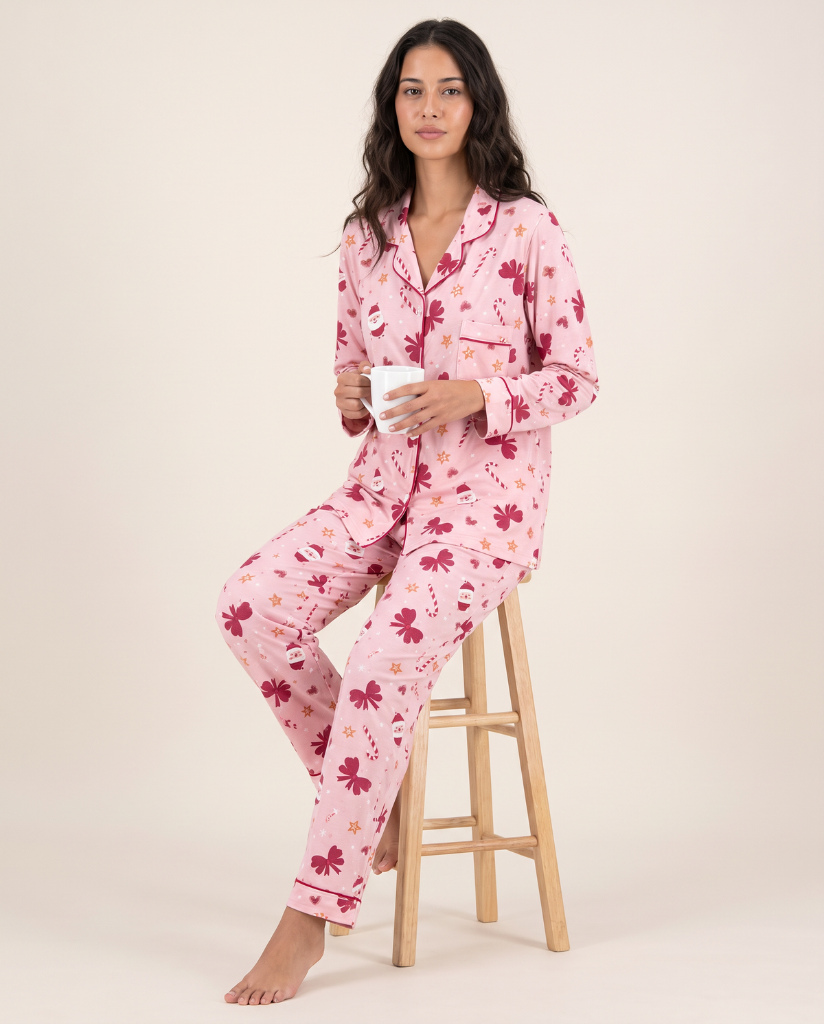 Women's Christmas Pajamas, Santa Print Button-Up PJ Set — pink, worn seated