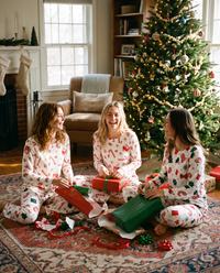 Women's Christmas Pajamas, Candy Cane Print Knit PJ Set — friends in matching pajamas opening presents on Christmas morning