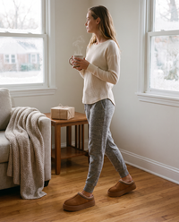 Women's Faux Suede Platform Slippers in chocolate worn on a cozy holiday morning at home with coffee