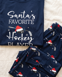 Family Christmas Pajamas, Santa's Favorite Hockey Player PJs — chest print and Santa-hat hockey puck pants print close-up