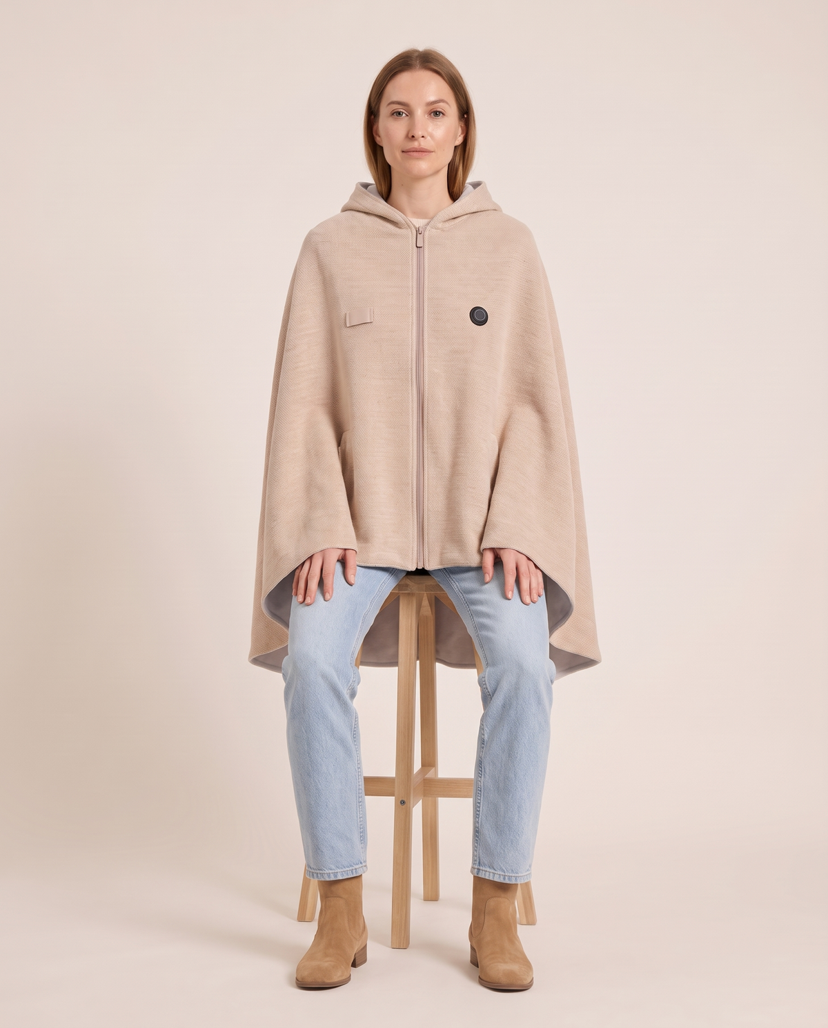 Women's Heated Shawl with Hood — seated on a wooden stool