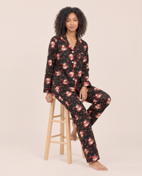 Women's Christmas Pajamas, Santa Claus Print Button-Up PJ Set — black, worn seated