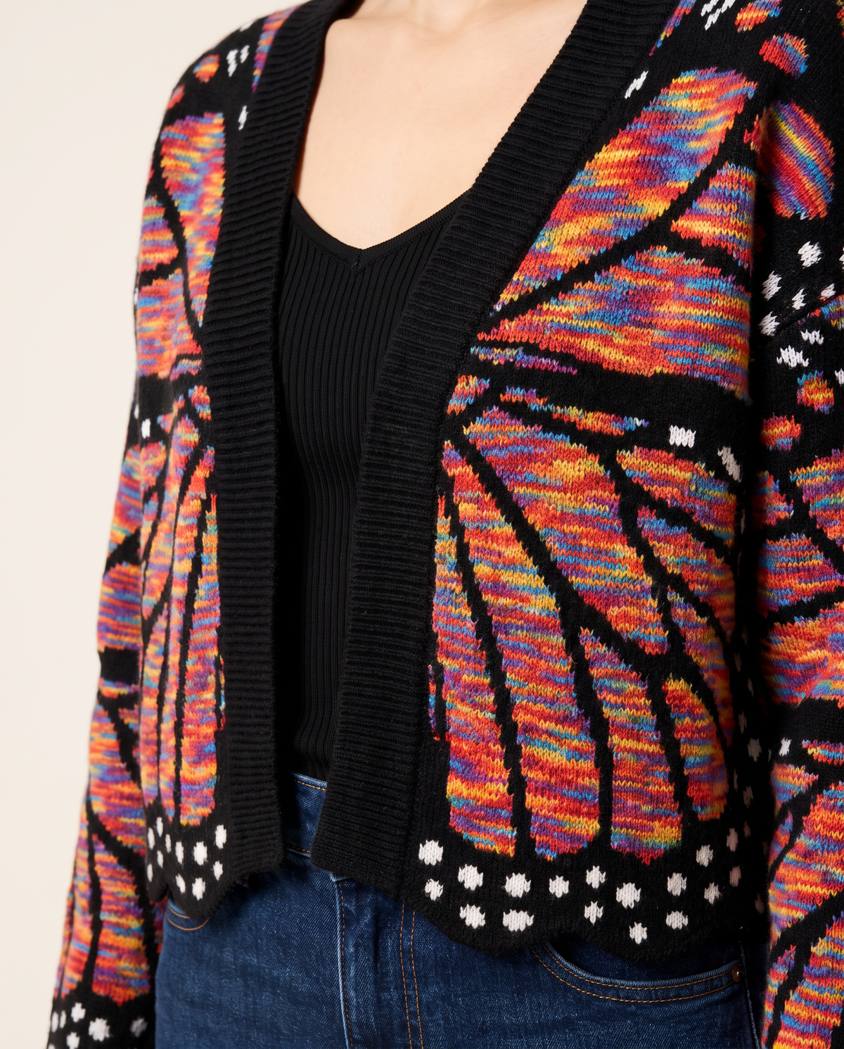 Women's Cropped Butterfly Wing Cardigan — rainbow, close-up of the knit wing pattern and dotted hem