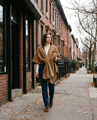 Camel fleece shawl wrap worn on a Brooklyn sidewalk with a morning coffee in late autumn