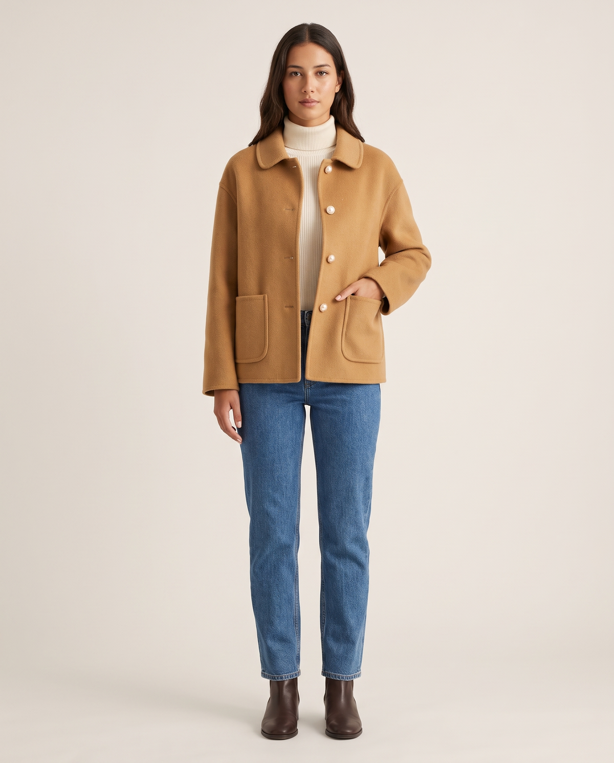 Women's Cropped Cashmere Coat in camel with Peter Pan collar and pearl buttons — studio front