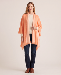 Women's Oversized Cashmere Wrap Scarf in Melon / Peach, studio front