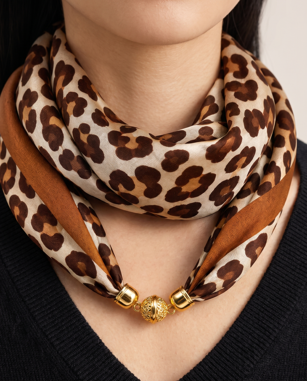 Women's Silky Leopard Neck Scarf, close-up of the leopard print and gold bead clasp