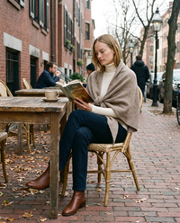 Women's Knit Triangle Shawl in Camel worn at a Boston cafe terrace