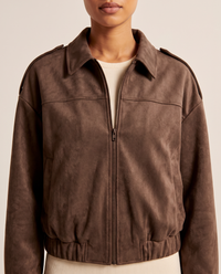 Women's Oversized Cropped Faux Suede Jacket — close-up of the point collar, zip, shoulder tabs and brushed suede texture
