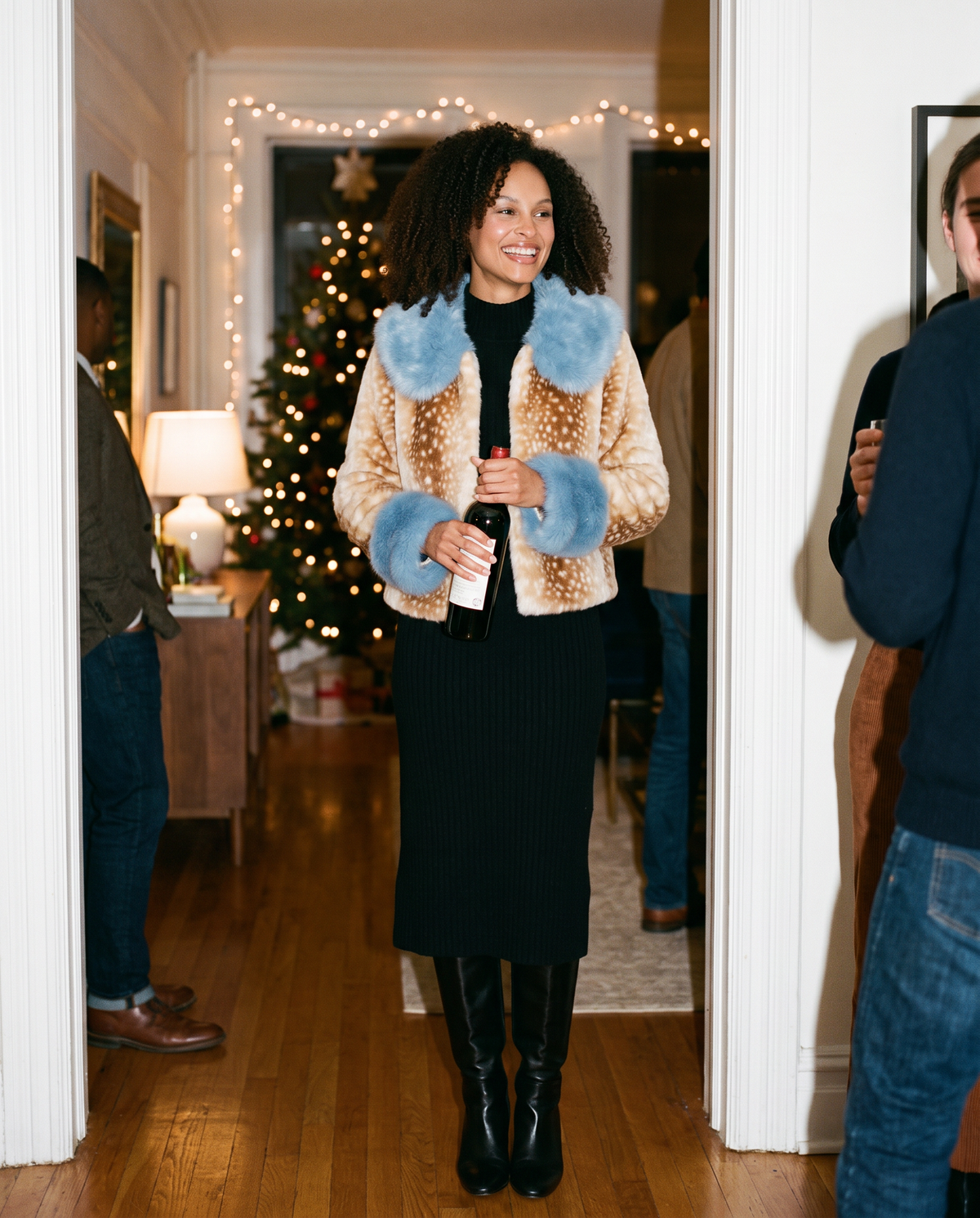 Women's Cropped Fawn Print Faux Fur Jacket with Blue Collar — arriving at a holiday get-together in Brooklyn