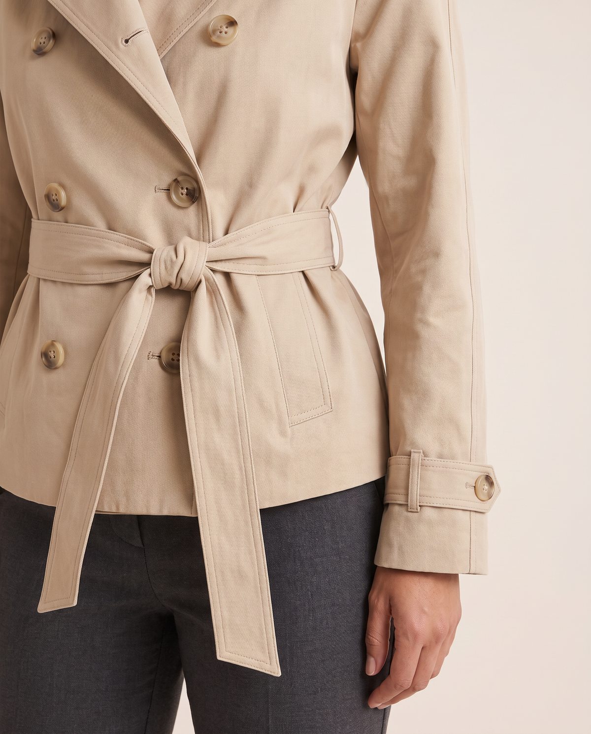 Trench jacket belt and button detail