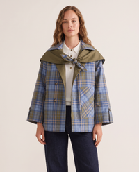 Reversible trench jacket worn plaid side out