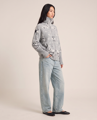 Chunky knit zip up cardigan for women, three-quarter view