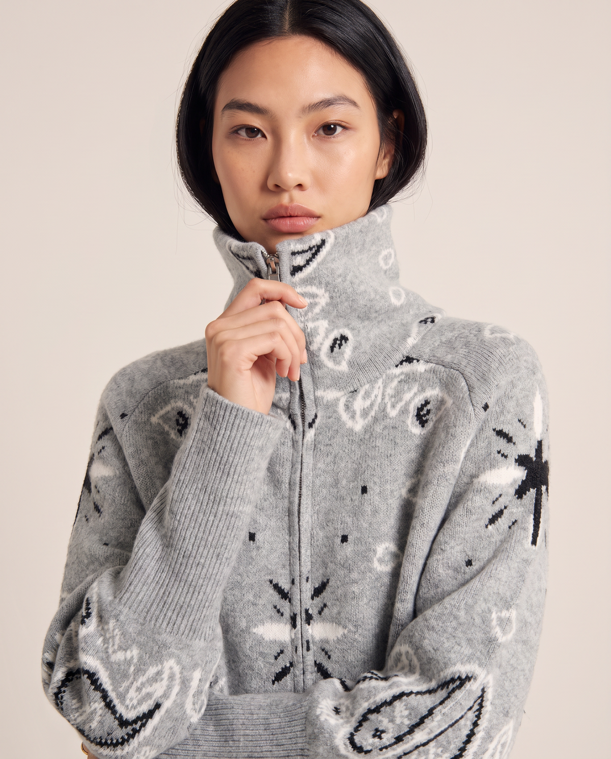 Funnel neck and paisley knit detail