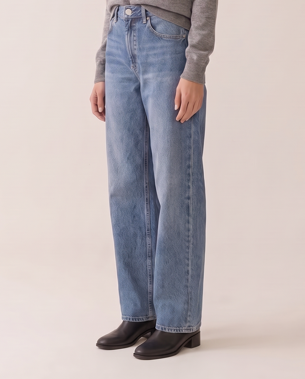 Baggy relaxed jeans, waist-down view