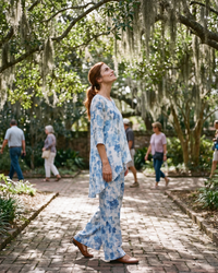 Bayfield Flowy Asymmetric Tunic and Pants Set — in a Charleston garden courtyard