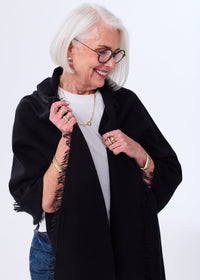 Women's Oversized Cashmere Wrap Scarf in Black, worn as a shawl