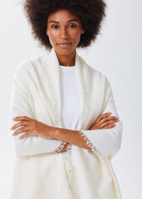 Women's Oversized Cashmere Wrap Scarf in Ivory, worn over the shoulders