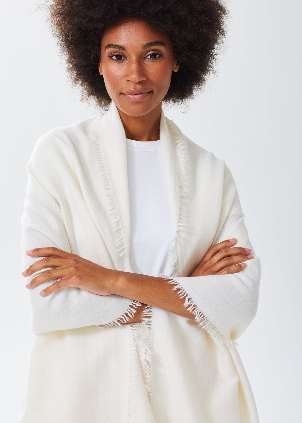 Women's Oversized Cashmere Wrap Scarf in Ivory, worn over the shoulders